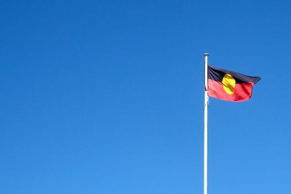 An Aboriginal flag on a pole.