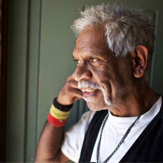 Portrait of an Aboriginal man with grey hair. 