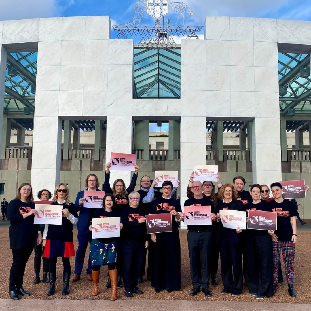 CLC workers out the front of Parliament House in Canberra as part of the Save Community Legal Centres campaign