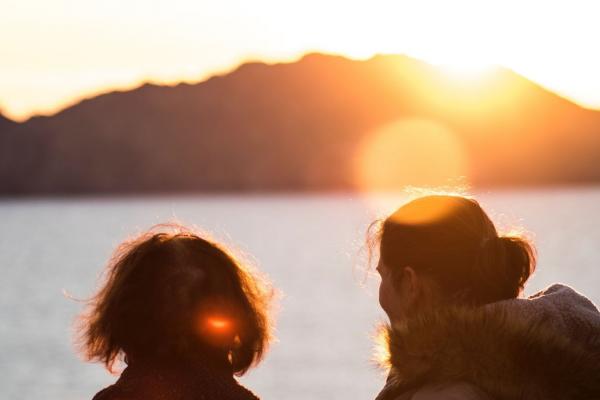 Two people at sunset.