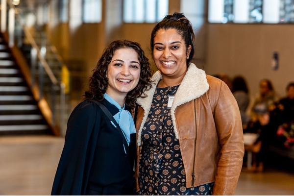 Two young people smiling at the CLCNSW Conference in May 2021.