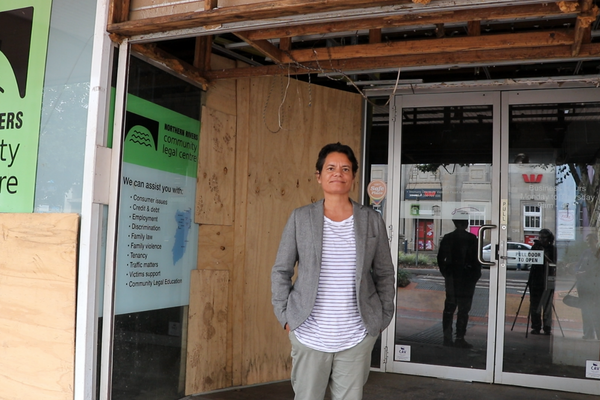 Nicole Jenkins outside the boarded-up and flood damaged Northern Rivers Community Legal Centre office