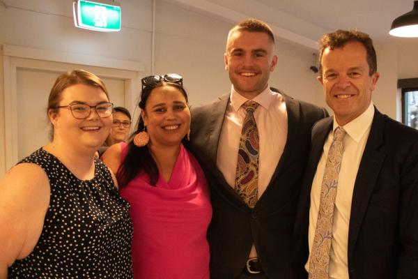 Celebrating the renewal of the First Nations Cadetship Program: Tonkya Jamieson (First Nations Cadet), Bobbi Murray (First Nations Cadetship Program Administrator), Oliver John Williams (First Nations Cadet), and Attorney General Mark Speakman.