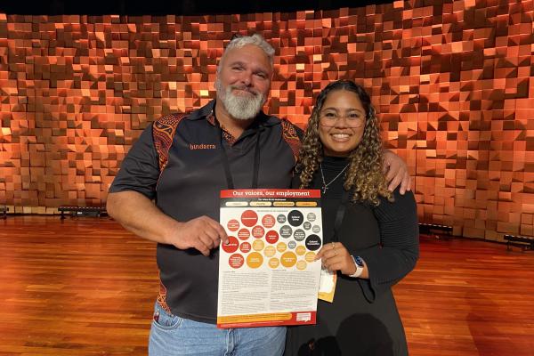 Dean McLaren and Taryn Ives Rigby launch the poster at the National Community Legal Centres Australia Conference.